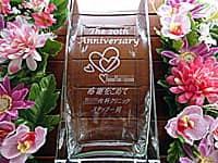 uThe 20th anniversaryAȃNjbÑS}[NAӂ߂ X^btꓯv𑤖ʂɒAȃNjbN20Njp̉ԕr